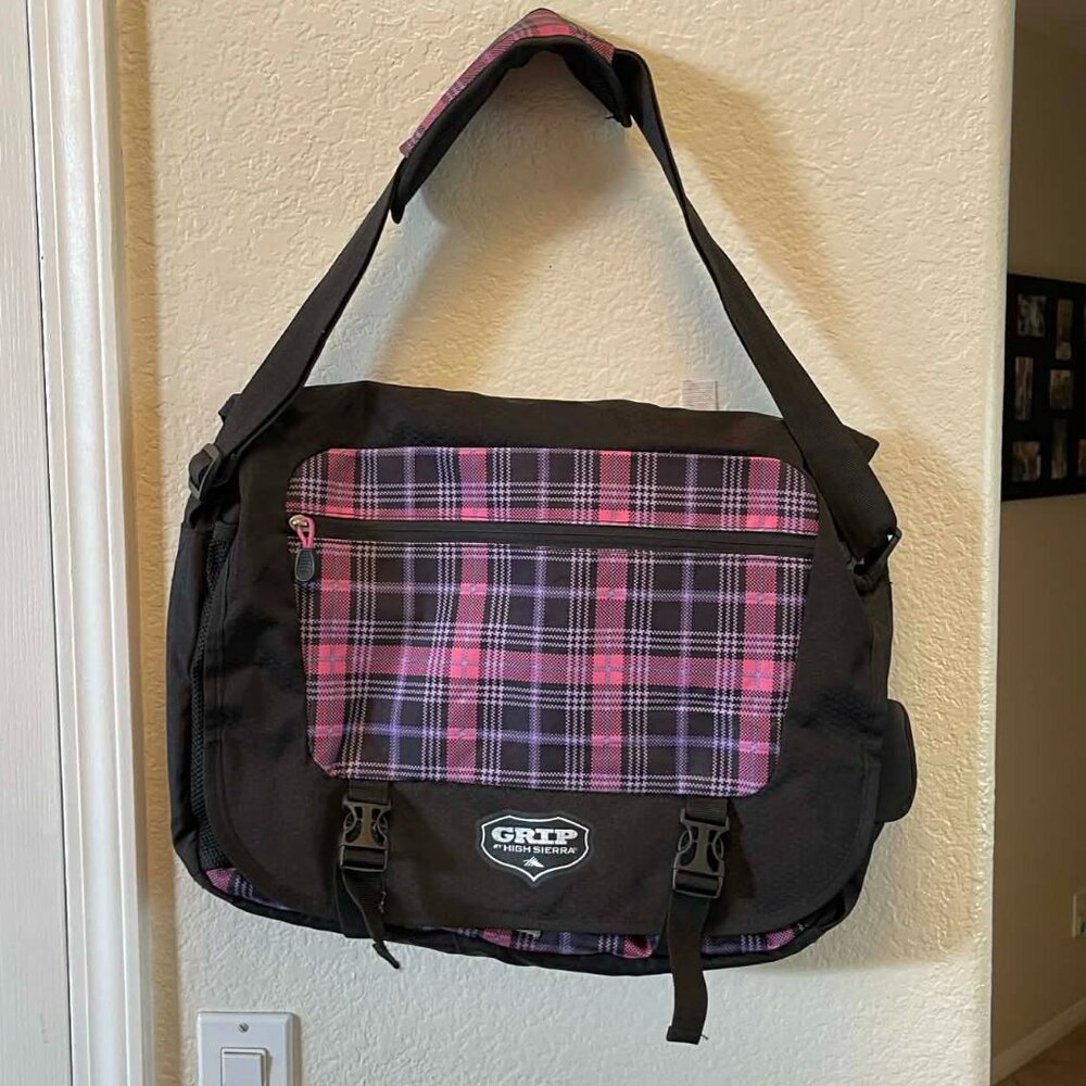 High Sierra Black Oversized Messenger Bag with Pink Plaid Front. 18” x 15” x 3”.